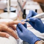 Technician working on nail